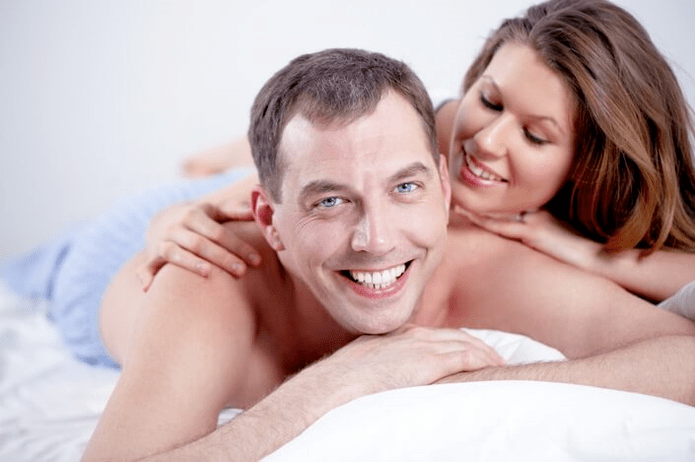 A man and woman in bed