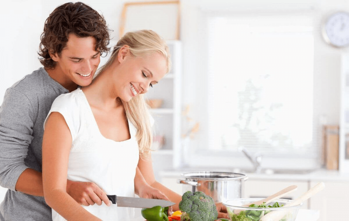 Young couple cooks